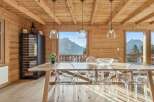 Experience luxury living in this stunning property featuring a dining area with breathtaking mountain views.