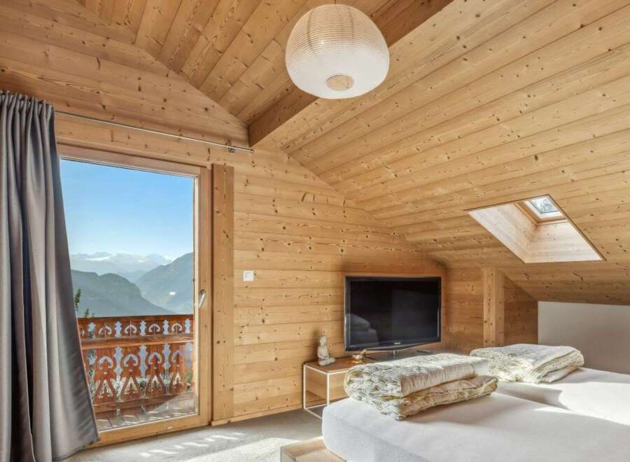 Experience the ultimate mountain retreat in this stunning bedroom.