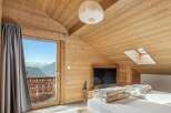 Experience the ultimate mountain retreat in this stunning bedroom.