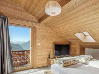 Experience the ultimate mountain retreat in this stunning bedroom.