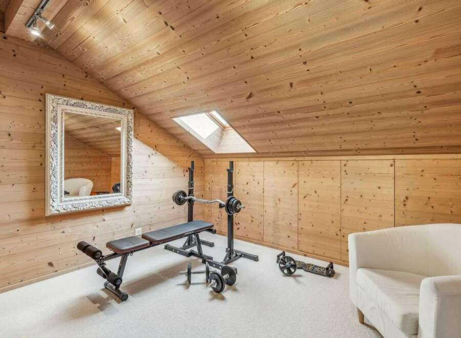 This stunning property boasts a dedicated home gym, perfect for fitness enthusiasts.
