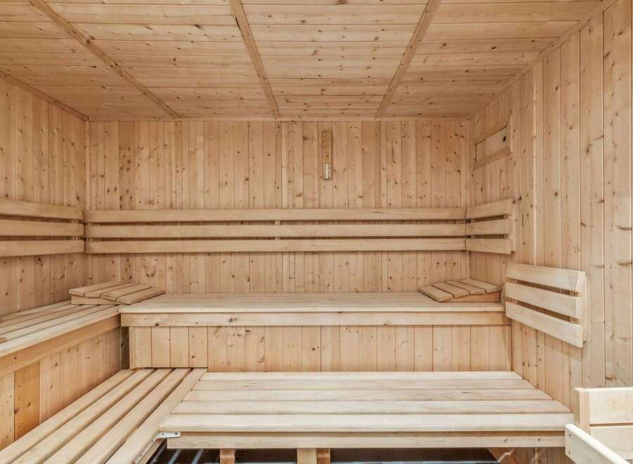Step into relaxation with this stunning sauna! Featuring beautiful wooden construction, this space offers a tranquil escape for unwinding.