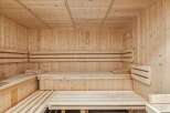 Step into relaxation with this stunning sauna! Featuring beautiful wooden construction, this space offers a tranquil escape for unwinding.