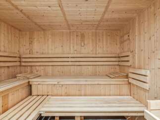 Step into relaxation with this stunning sauna! Featuring beautiful wooden construction, this space offers a tranquil escape for unwinding.