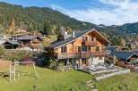 Discover the charm of this stunning wooden chalet nestled in a picturesque mountain setting.