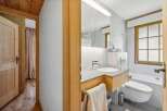 This charming bathroom features a modern design with a touch of rustic elegance.