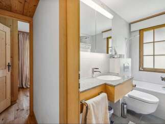 This charming bathroom features a modern design with a touch of rustic elegance.