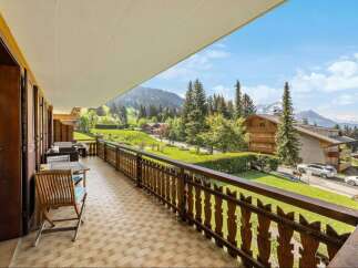 Enjoy breathtaking mountain views from this stunning balcony.