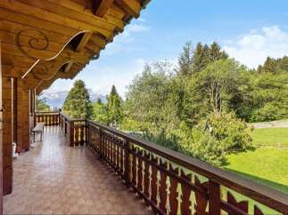 Enjoy breathtaking mountain views from this charming balcony.