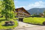 Discover the charm of this stunning wooden chalet nestled in a picturesque mountain setting.
