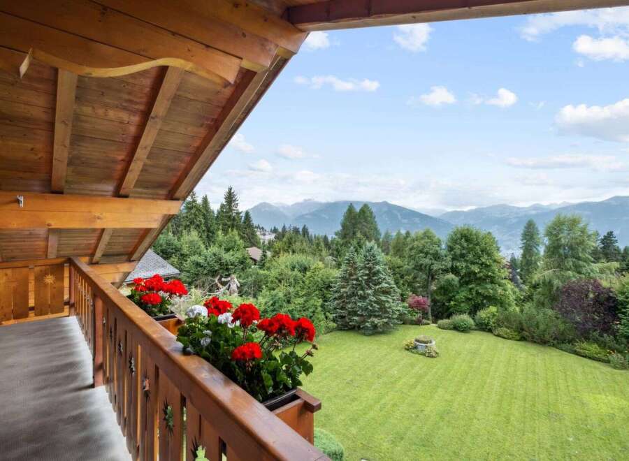 Enjoy breathtaking mountain views from this charming balcony.