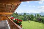 Enjoy breathtaking mountain views from this charming balcony.