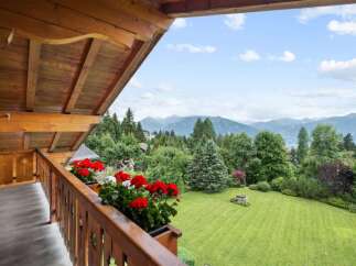 Enjoy breathtaking mountain views from this charming balcony.