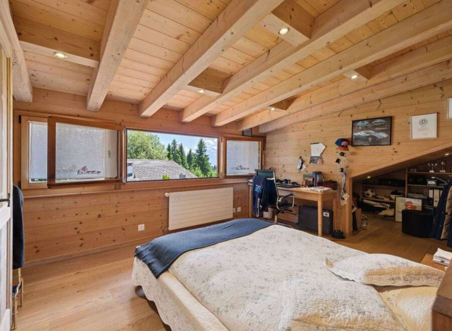 This stunning bedroom boasts a unique wooden design, creating a warm and inviting atmosphere.