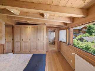Experience the warmth and charm of this stunning wooden bedroom.