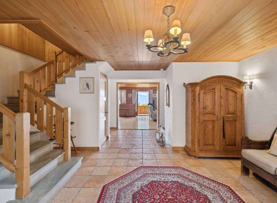 Step into luxury with this stunning property featuring a grand entrance and a beautiful staircase.