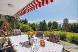 Enjoy breathtaking mountain views from this charming outdoor dining area.