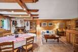 Step into a cozy retreat with this charming property, featuring a rustic interior design.