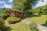 Escape to your own private oasis with this charming wooden cabin nestled in a serene natural setting.