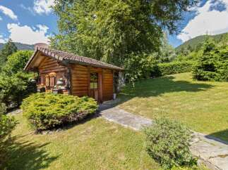Escape to your own private oasis with this charming wooden cabin nestled in a serene natural setting.