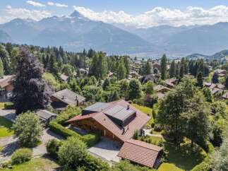 Discover your dream home nestled in the heart of nature, offering breathtaking mountain views and a serene atmosphere.