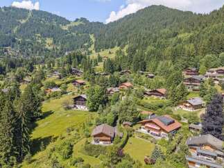 Nestled in a picturesque mountain landscape, this property offers a serene retreat.
