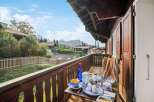 Enjoy breathtaking mountain views from this charming balcony.