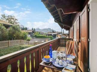 Enjoy breathtaking mountain views from this charming balcony.