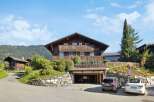 This stunning chalet-style home offers a blend of rustic charm and modern convenience.