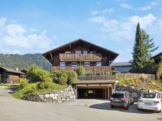 This stunning chalet-style home offers a blend of rustic charm and modern convenience.