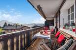 Enjoy breathtaking mountain views from this charming balcony.