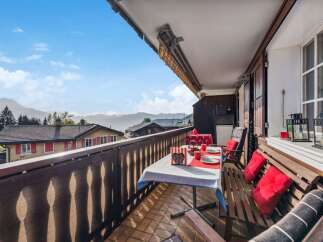 Enjoy breathtaking mountain views from this charming balcony.