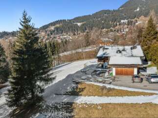 Nestled in a picturesque mountain setting, this stunning property offers a serene escape.