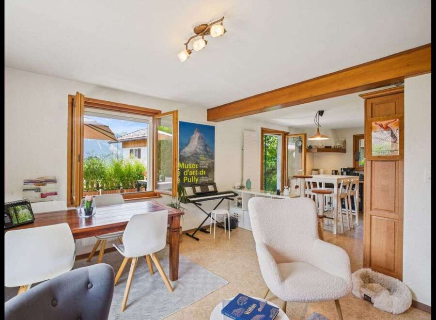 Step into this inviting living space, featuring a bright and airy atmosphere with large windows that frame stunning views.