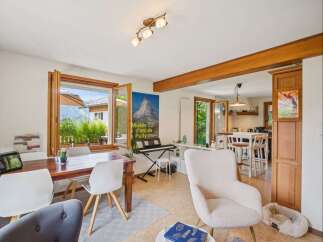 Step into this inviting living space, featuring a bright and airy atmosphere with large windows that frame stunning views.