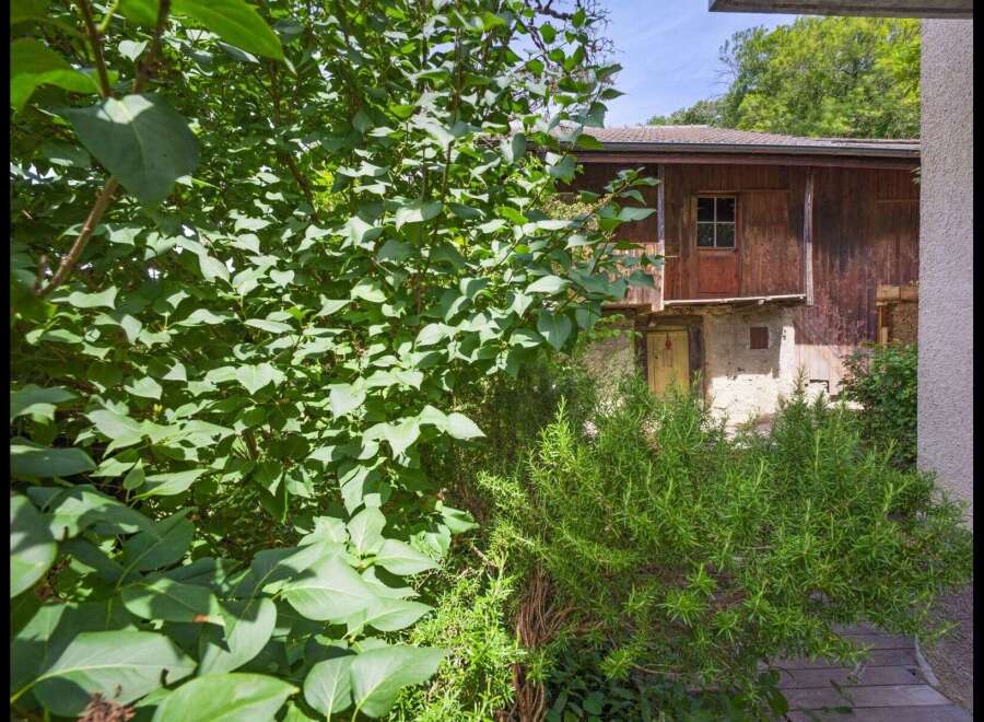 Discover a charming property nestled in a serene, natural setting.