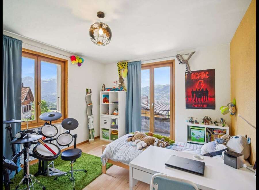 This vibrant bedroom offers a playful and inspiring space.