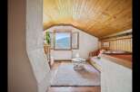Discover the charm of this cozy attic space, perfect for a guest room or a relaxing retreat.