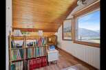 Discover the charm of this cozy attic space, perfect for a home library or reading nook.