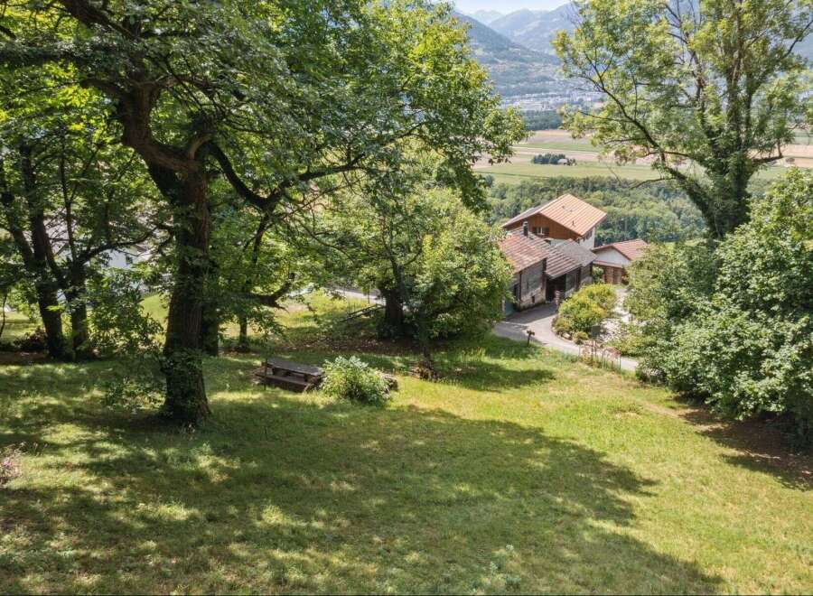 Nestled amidst lush greenery and offering breathtaking mountain views, this charming property is a true sanctuary.