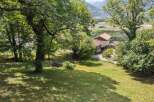 Nestled amidst lush greenery and offering breathtaking mountain views, this charming property is a true sanctuary.