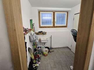 Discover this charming property featuring a functional mudroom, perfect for storing outdoor gear.