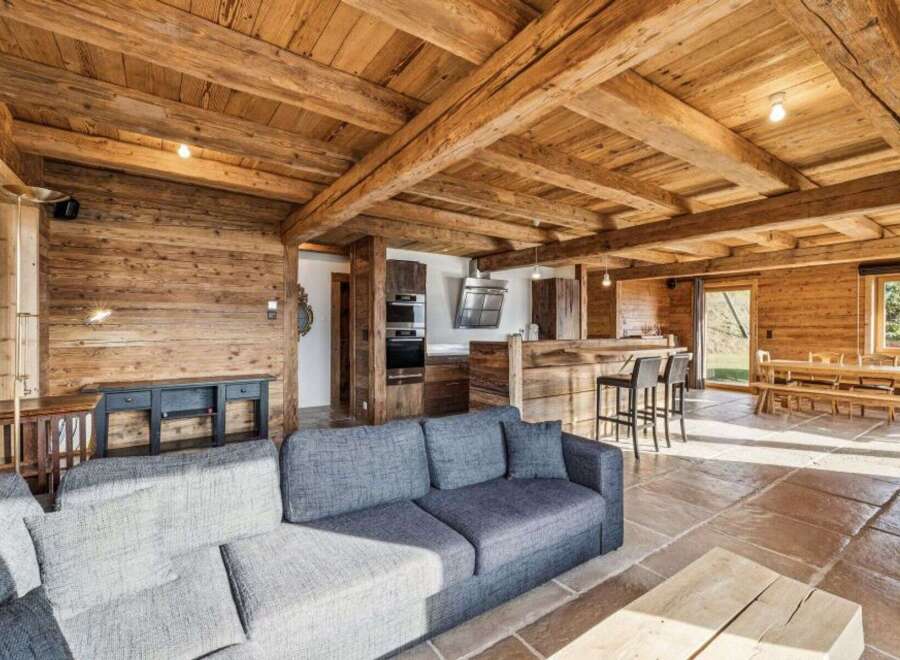 Experience rustic elegance in this stunning property, featuring exposed wooden beams and walls that exude warmth and charm.