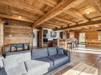 Experience rustic elegance in this stunning property, featuring exposed wooden beams and walls that exude warmth and charm.
