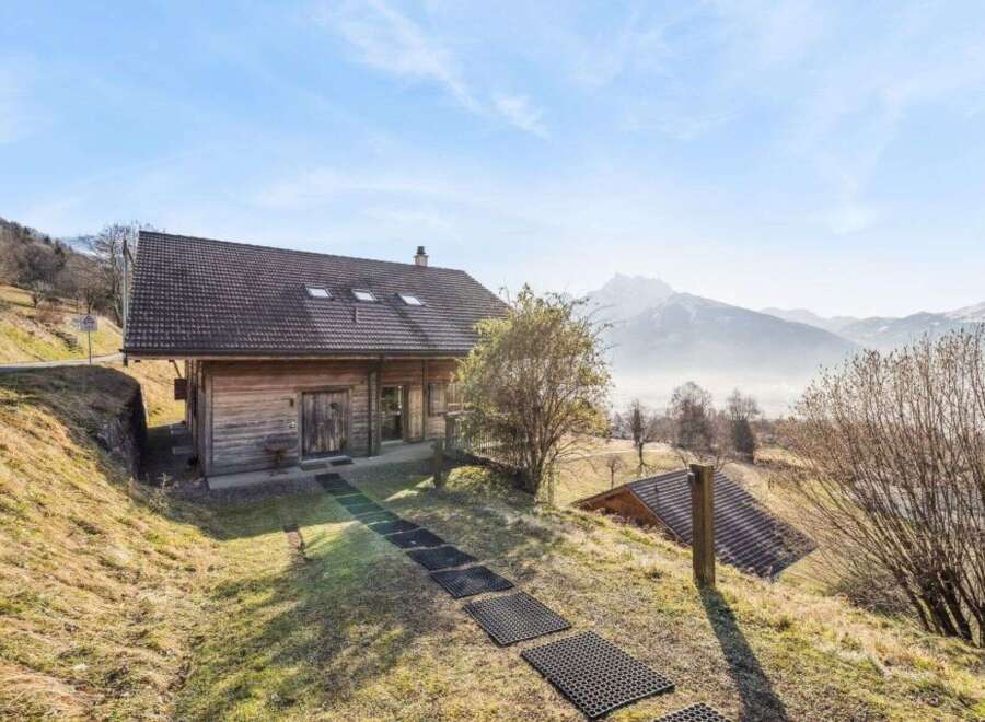 Nestled in a serene mountain landscape, this charming wooden cabin offers a perfect blend of rustic charm and modern comfort.