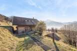 Nestled in a serene mountain landscape, this charming wooden cabin offers a perfect blend of rustic charm and modern comfort.