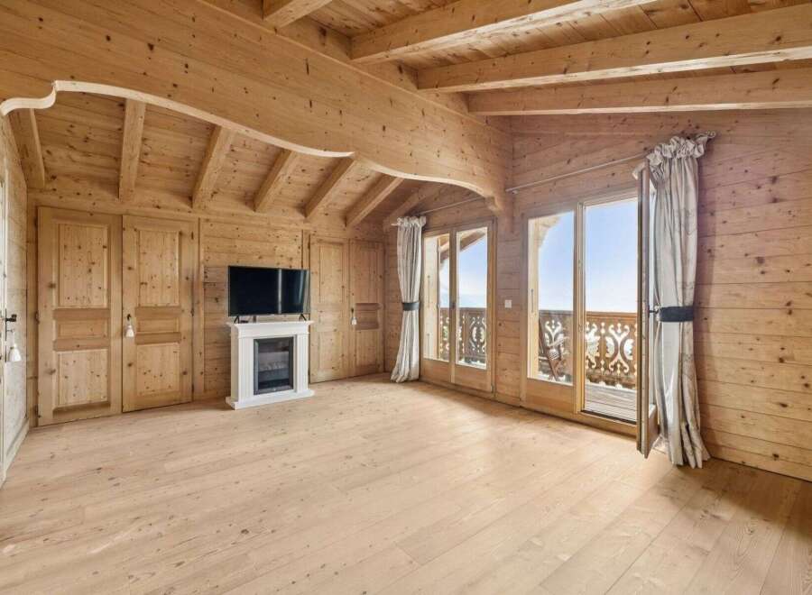 Step into a world of rustic elegance with this stunning property, showcasing exquisite wooden architecture throughout.