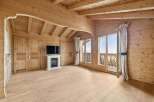 Step into a world of rustic elegance with this stunning property, showcasing exquisite wooden architecture throughout.