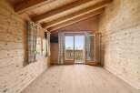 Step into a cozy retreat with this stunning wooden interior.