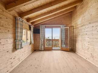Step into a cozy retreat with this stunning wooden interior.